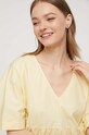Бавовняна сукня Tommy Jeans жовтий DW0DW17948