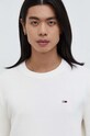 Хлопковый свитер Tommy Jeans бежевый DM0DM18370
