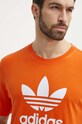 Бавовняна футболка adidas Originals помаранчевий IR8000