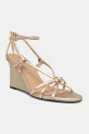 Tommy Hilfiger sandały skórzane METAL LEATHER KNOTS WEDGE SANDAL 5-8 cm złoty FW0FW08801