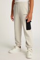 Детские хлопковые штаны Calvin Klein Jeans BLOCK CARGO хлопок бежевый IB0IB02349.PPYA