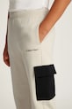Dječji pamučni donji dio trenirke Calvin Klein Jeans BLOCK CARGO IB0IB02349.PPYA bež