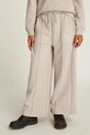 Дитячі спортивні штани Calvin Klein Jeans HANDW LOGO WIDE трикотаж бежевий IG0IG02775.128.176.PPYA