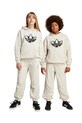 Дитячі спортивні штани adidas Originals трикотаж бежевий JC9073