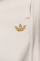 Дитячі спортивні штани adidas Originals бежевий JC9073