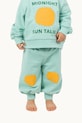 Tinycottons pantaloni de trening din bumbac pentru bebeluși SUN TALES GRAPHIC BABY SWEATPANT verde SS25.106
