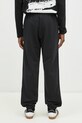 Одяг Бавовняні спортивні штани adidas Originals Essential JC9575 чорний