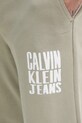 Bavlněné tepláky Calvin Klein Jeans béžová J30J327535