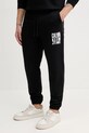 Bavlněné tepláky Calvin Klein Jeans potisk černá J30J327535