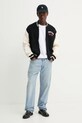 Bavlněný kardigan Tommy Jeans DM0DM20306 černá SS25