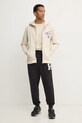 Хлопковая футболка Tommy Jeans DM0DM21106 бежевый SS25
