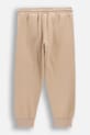 Coccodrillo spodnie dresowe dziecięce z bawełną WC6120103NBK beżowy SS26