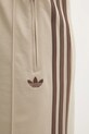 adidas Originals spodnie dresowe Firebird beżowy KD3660