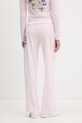 Odzież Juicy Couture spodnie dresowe welurowe Wrap You Up JCNBJ126452 różowy