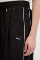 Puma spodnie dresowe Piping Relaxed Woven czarny 634559