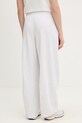Odzież Puma spodnie dresowe bawełniane Wardrobe Essentials 634583 biały