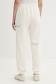 Odzież Converse spodnie dresowe damskie CVW6B094 beżowy