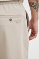Maison Kitsuné kalhoty pánské béžová QM01104WW9107
