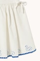 Tinycottons sukienka z dodatkiem lnu dziecięca SWANS BOWS DRESS biały SS26.229