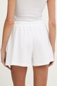 Oblačila Guess trenirka kratke hlače ženske bombažne GIADA E6GD01.KCRZ1 bela