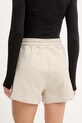 Odzież adidas by Stella McCartney szorty dresowe damskie bawełniane KC1821 beżowy