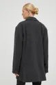 Μάλλινο παλτό Herskind  Κύριο υλικό: 70% Ανακυκλωμένος πολυεστέρας, 10% Πολυαμίδη Φόδρα: 100% Oξικό άλας