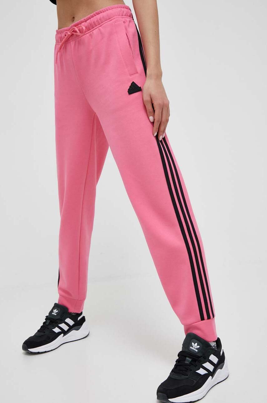 pink and black adidas track pants