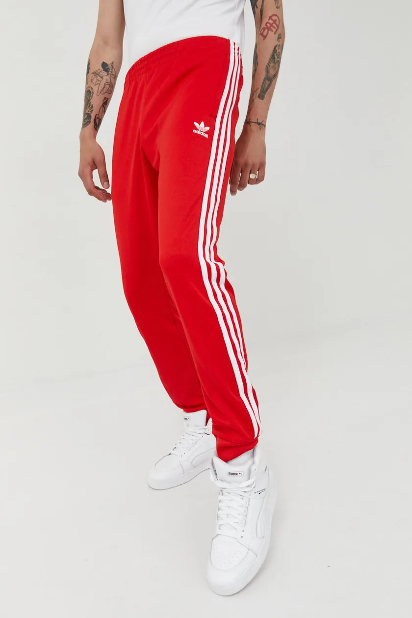 adidas Originals spodnie dresowe Adicolor kolor czerwony z aplikacją | Answear.com
