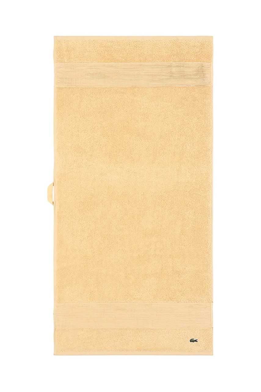 Levně Střední bavlněný ručník Lacoste L LECROCO Sesame 50 x 100 cm žlutá barva