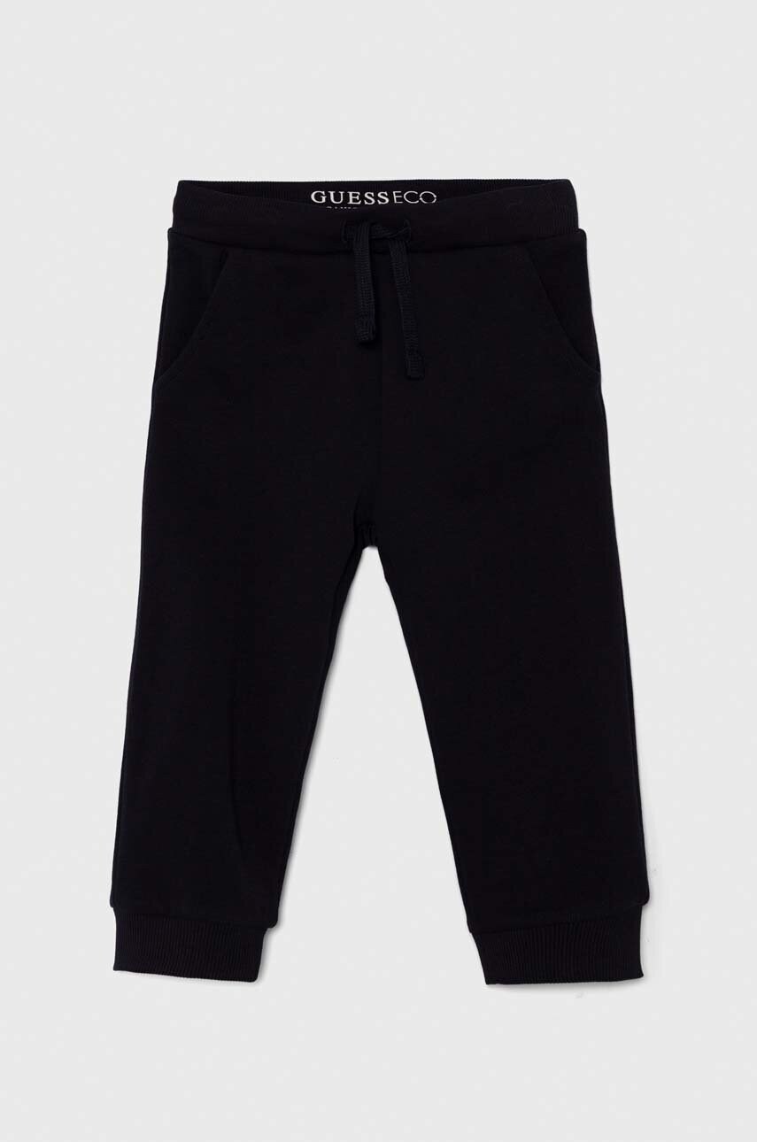 Levně Dětské bavlněné tepláky Guess tmavomodrá barva, N93Q17 KAUG0