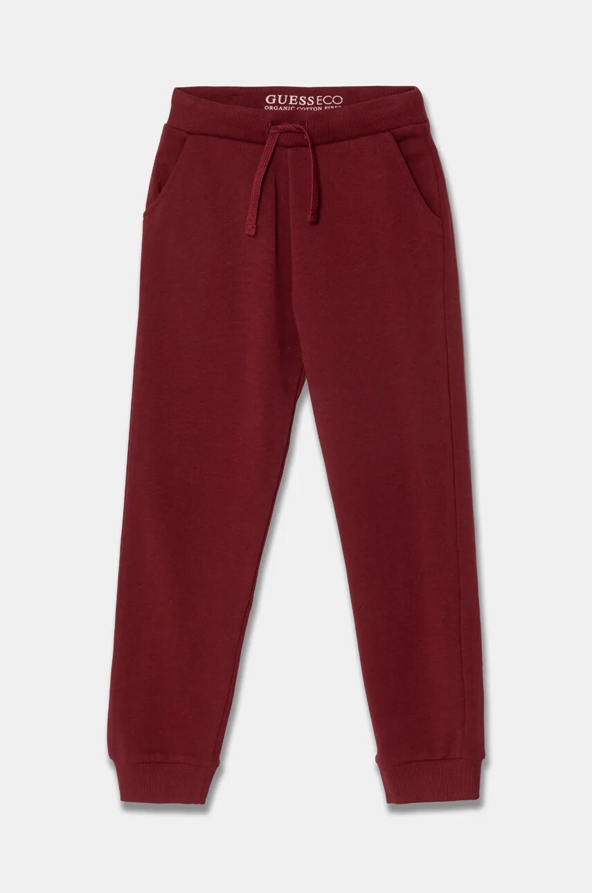 Levně Dětské bavlněné tepláky Guess vínová barva, N93Q17 KAUG0