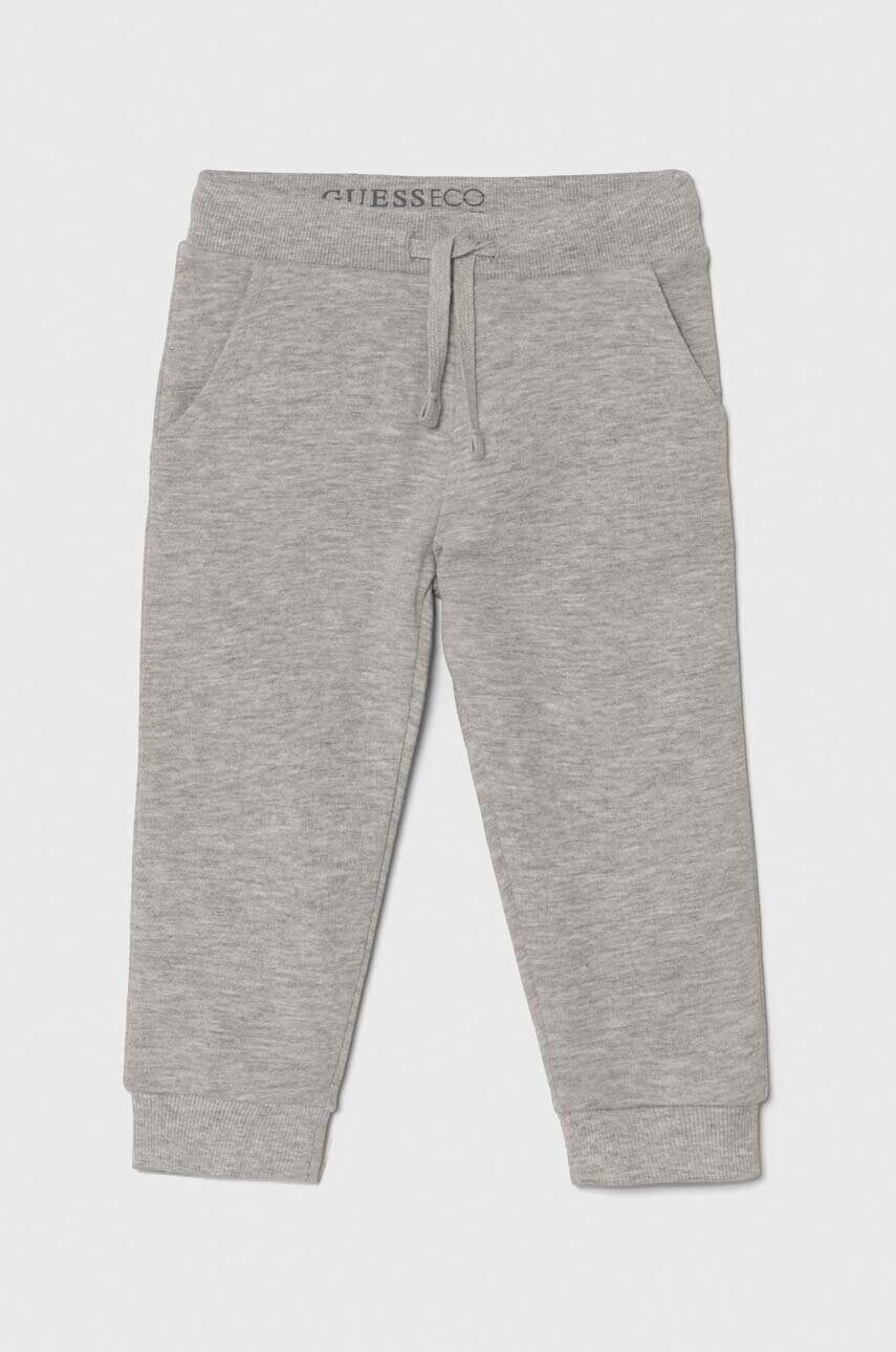 Levně Dětské bavlněné tepláky Guess šedá barva, N93Q17 KAUG0