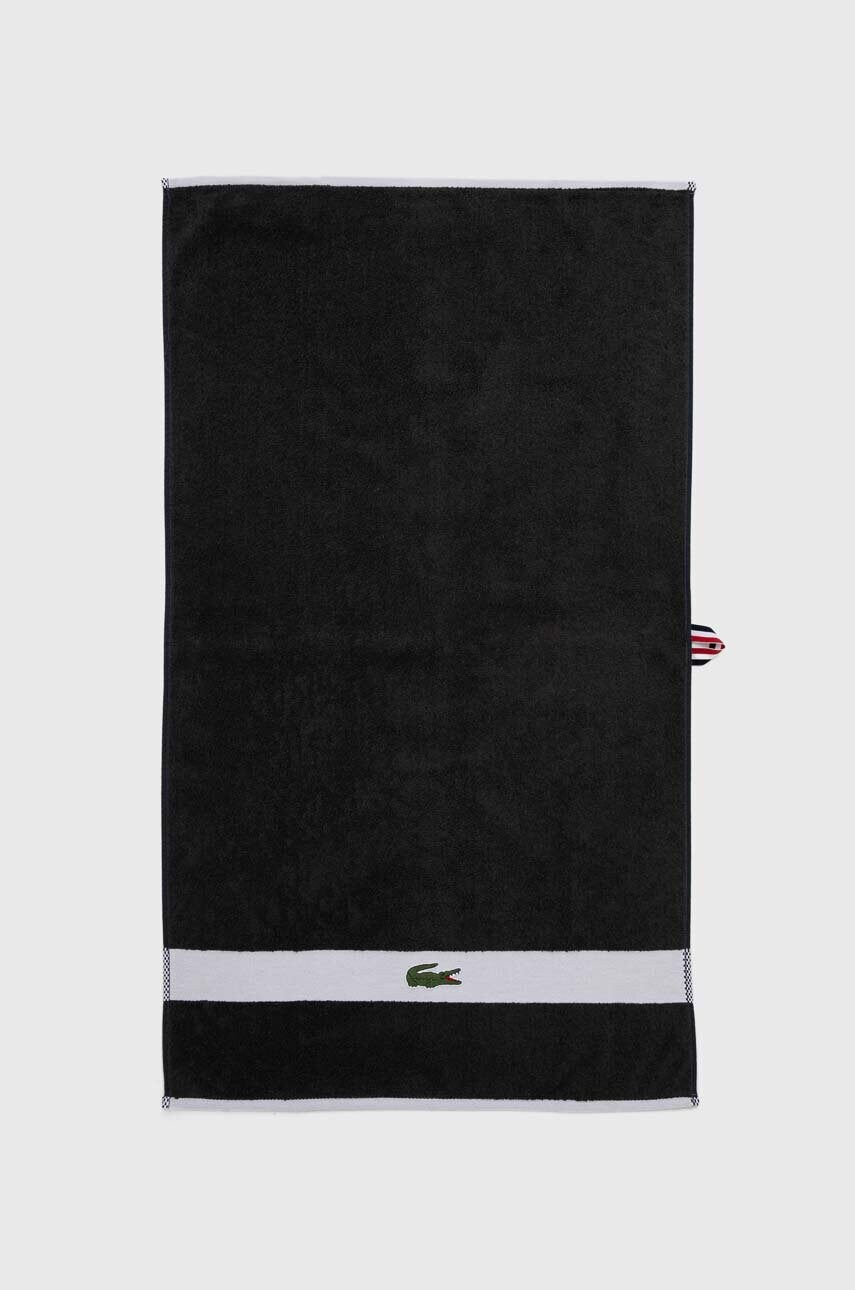 Levně Bavlněný ručník Lacoste L Casual Bitume 55 x 100 cm