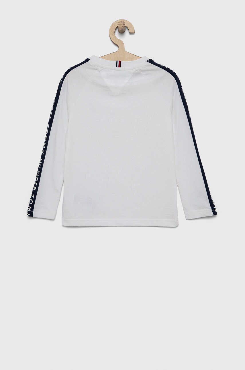 

Дитячий бавовняний лонгслів Tommy Hilfiger колір білий гладкий