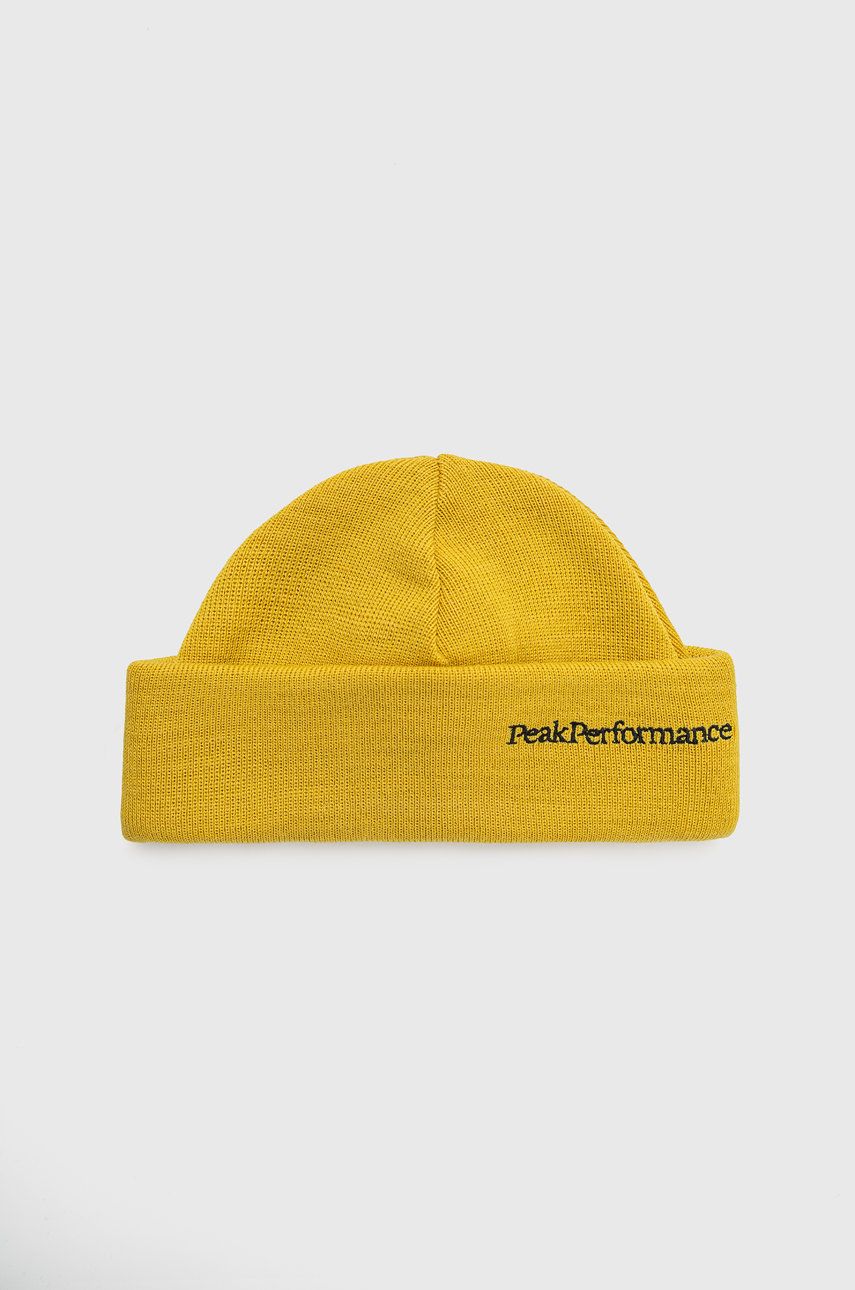 Vlněná čepice Peak Performance žlutá barva, z tenké pleteniny, vlněná - žlutá -  50% Akryl