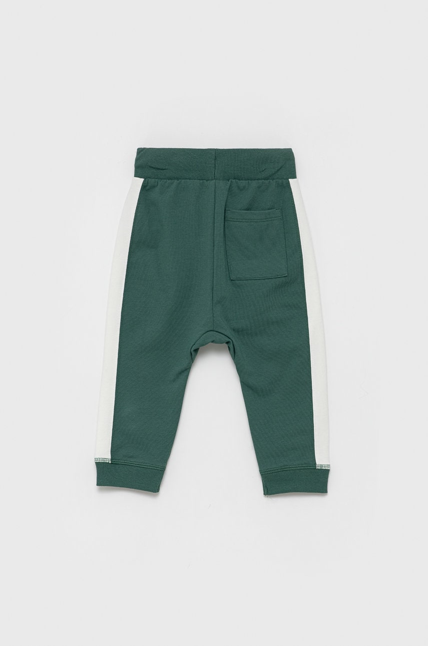 Дитячі штани United Colors of Benetton колір зелений гладке