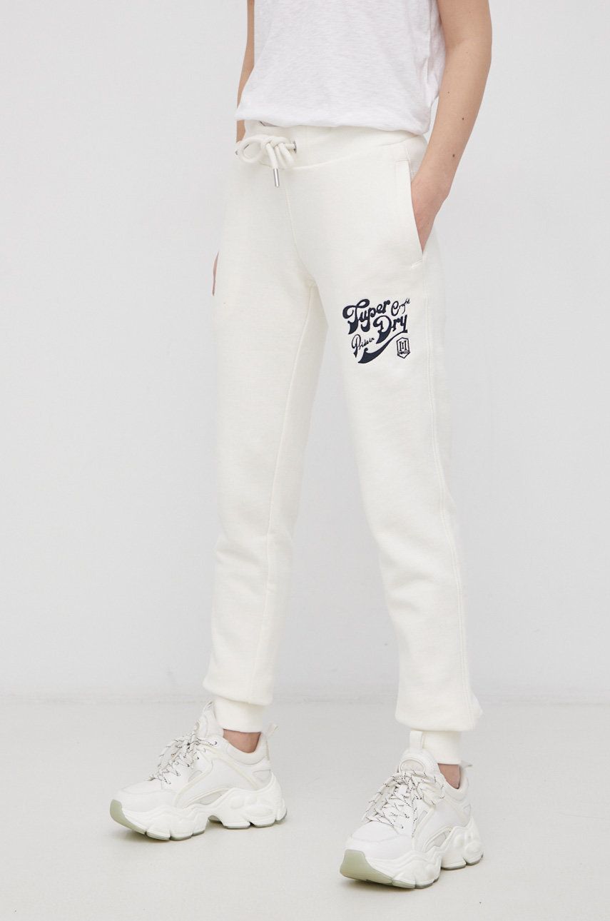 Kalhoty Superdry dámské, krémová barva, s aplikací - béžová -  73% Bavlna