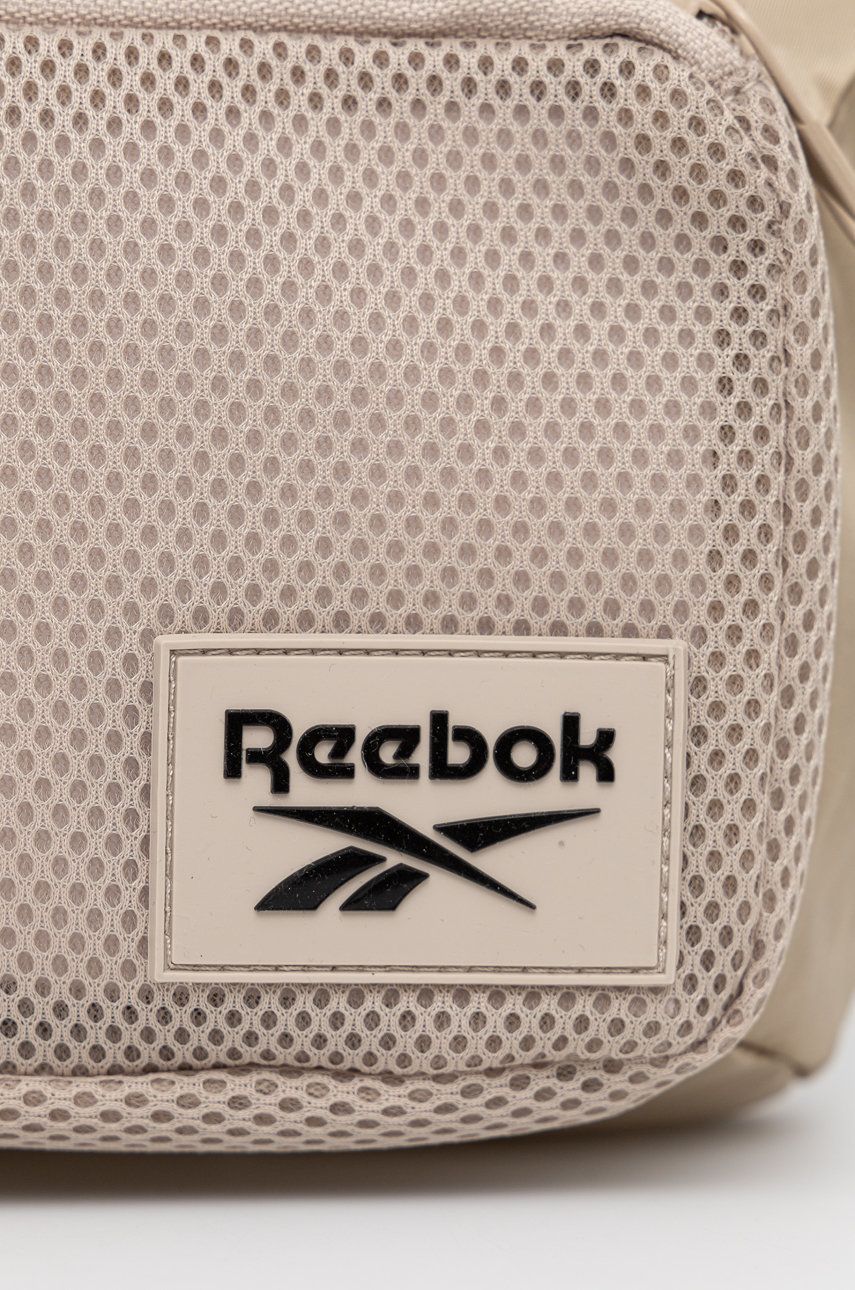 

Сумка на пояс Reebok H45116 колір бежевий