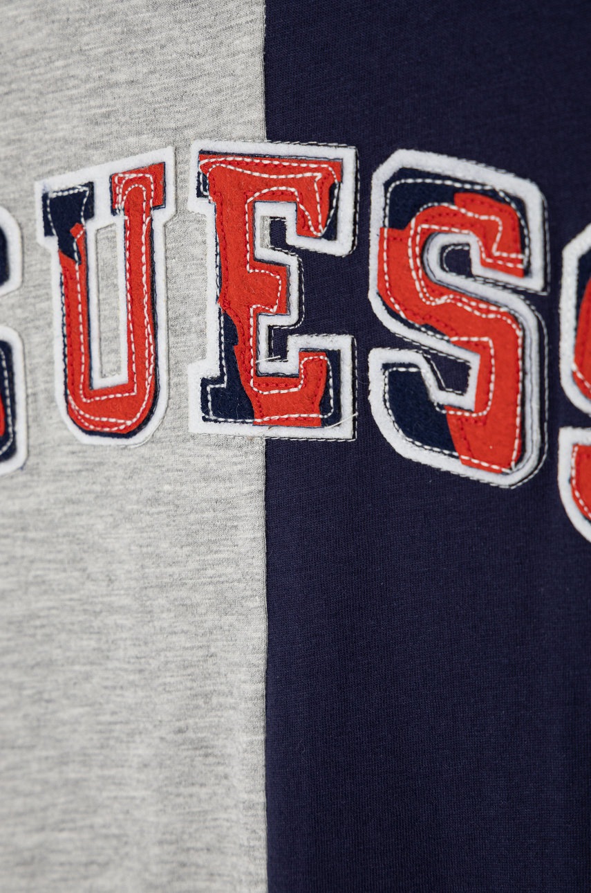 

Дитяча бавовняна футболка Guess колір синій з аплікацією
