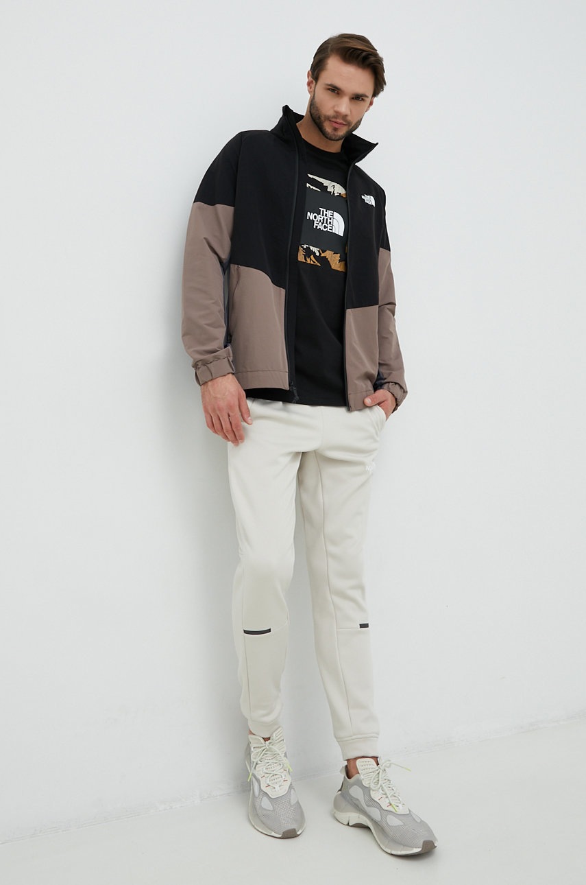 

Хлопковый лонгслив The North Face цвет чёрный с принтом