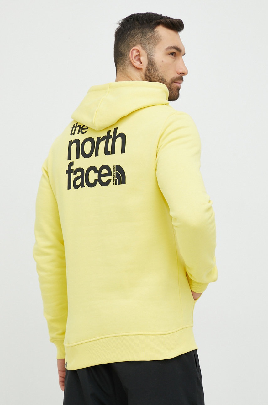 

Памучен суичър The North Face в жълто с качулка с принт, Жълт
