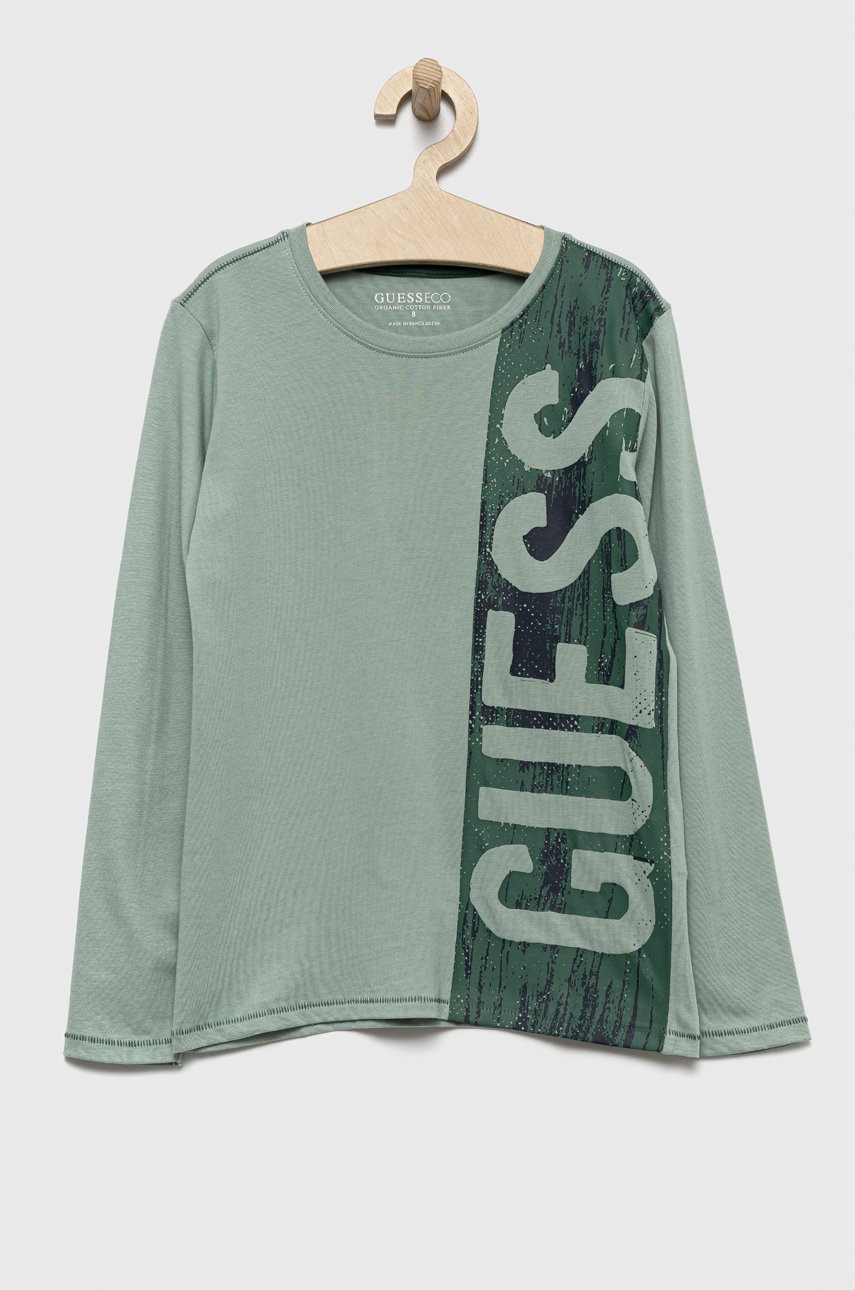 

Хлопковый детский лонгслив Guess цвет бирюзовый с принтом