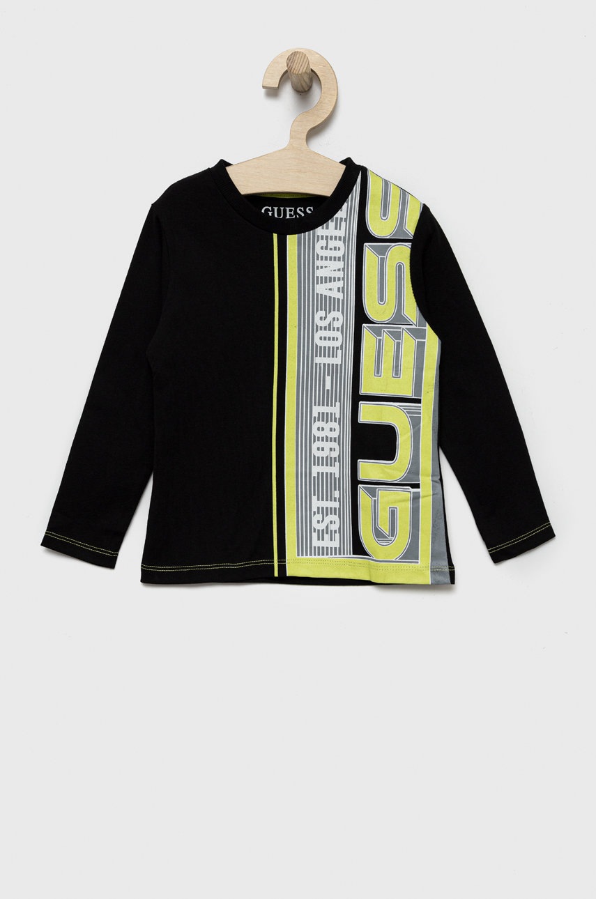

Дитячий бавовняний лонгслів Guess колір чорний з принтом