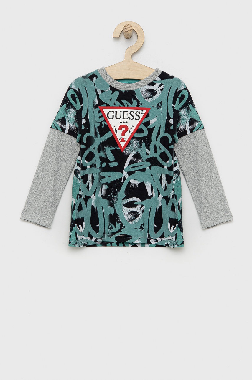 

Хлопковый детский лонгслив Guess цвет бирюзовый с принтом