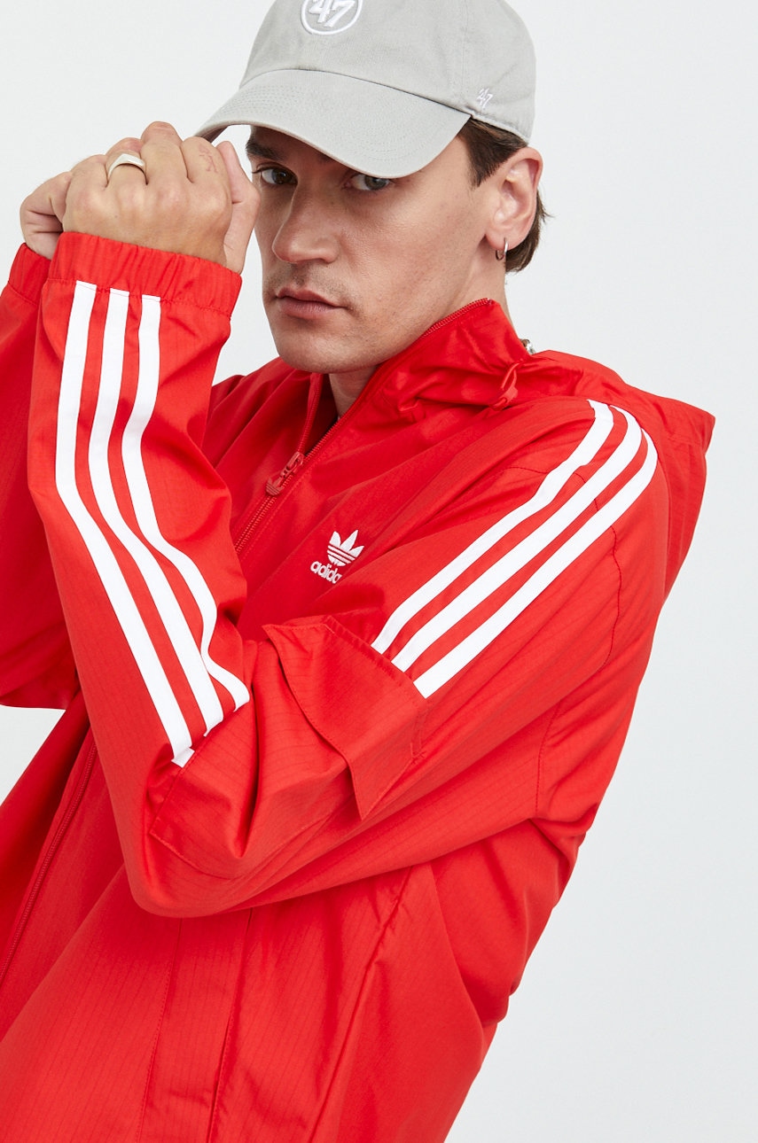 Levně Bunda adidas Originals pánská, červená barva, přechodná