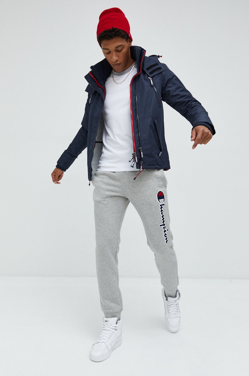 

Куртка Superdry чоловіча колір синій перехідна