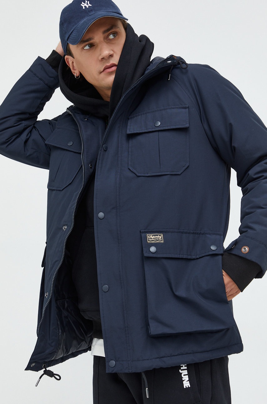

Куртка Superdry чоловіча колір синій зимова