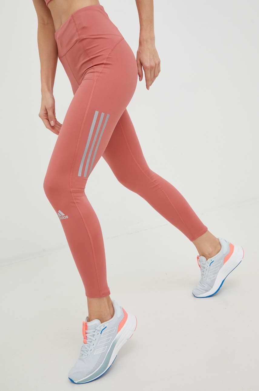 Levně Běžecké legíny adidas Performance Own The Run Winter oranžová barva, s potiskem