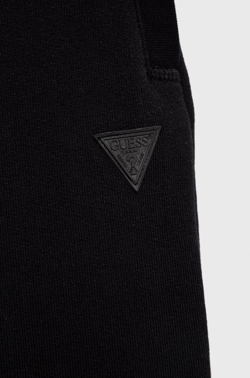 Детские спортивные штаны Guess цвет чёрный меланж Детские спортивные штаны Guess цвет чёрный меланж