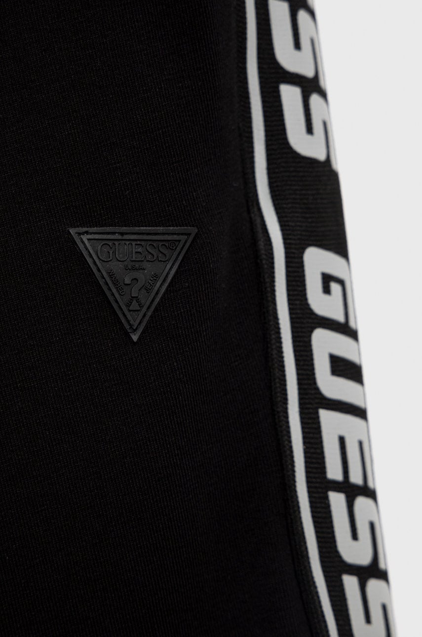 Детские спортивные штаны Guess цвет чёрный с аппликацией